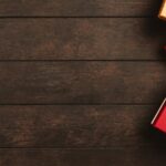 Decorative holiday gift boxes with ribbons on a rustic wooden surface, perfect for seasonal themes.