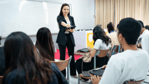 University lecturer teaching students in classroom