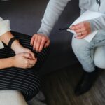A supportive moment during a counseling session, featuring attentive listening and comfort.